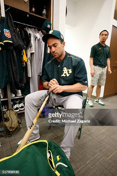 Sam Fuld of the Oakland Athletics puts mota stick on his bat in the clubhouse during a spring training workout at Fitch Park on February 28, 2016 in...