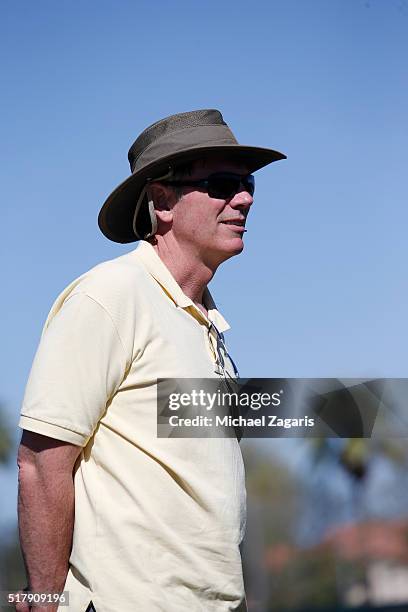 Executive Vice President of Baseball Operations Billy Beane of the Oakland Athletics stands on the field during a spring training workout at Fitch...