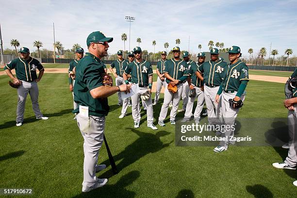 Bench Coach Mark Kotsay of the Oakland Athletics addresses the team during a spring training workout at Fitch Park on March 2, 2016 in Mesa, Arizona.