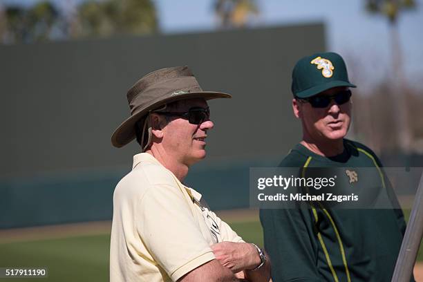Executive Vice President of Baseball Operations Billy Beane of the Oakland Athletics stands on the field with Manager Bob Melvin during a spring...