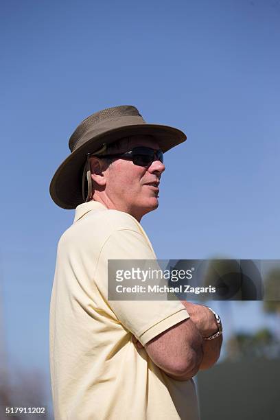 Executive Vice President of Baseball Operations Billy Beane of the Oakland Athletics stands on the field during a spring training workout at Fitch...