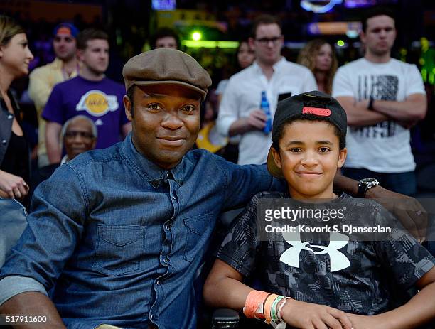 Actor David Oyelowo and son Caleb attend the basketball game between the Denver Nuggets and the Los Angeles Lakers at Staples Center on March 25,...