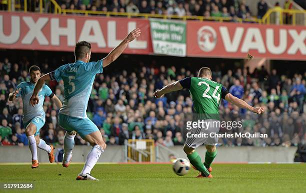 Conor Washington of Northern Ireland scores during the international friendly between Northern Ireland and Slovenia at Windsor Park on March 28, 2016...