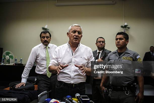 Otto Perez Molina, Guatemala's former president, center, speaks during a court appearance in Guatemala City, Guatemala, on Monday, March 28, 2016....