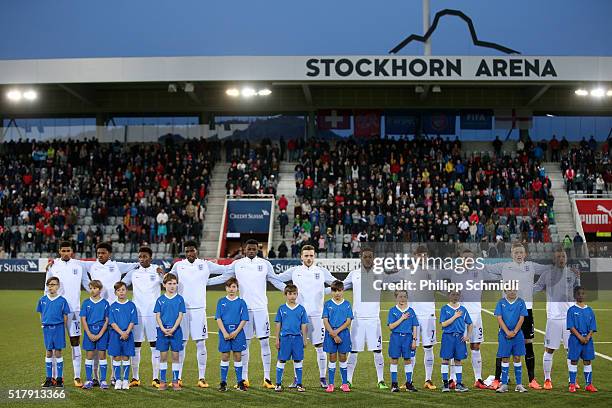 Players of England U21 line up for the national anthem prior to the European Under 21 Qualifier match between Switzerland U21 and England U21 at...