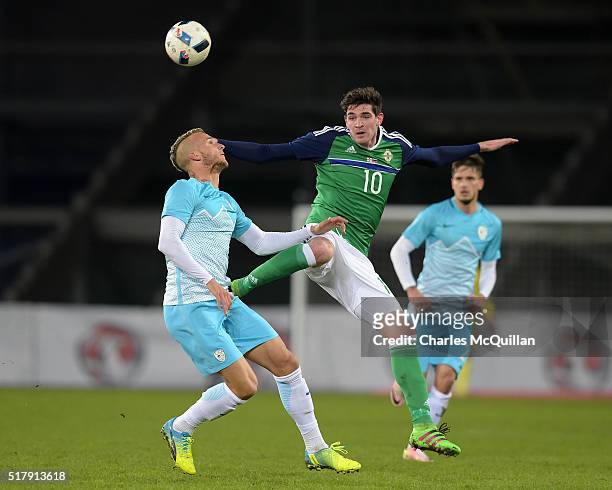Kyle Lafferty of Northern Ireland and Struna Aljaz of Slovenia in action during the international friendly between Northern Ireland and Slovenia at...