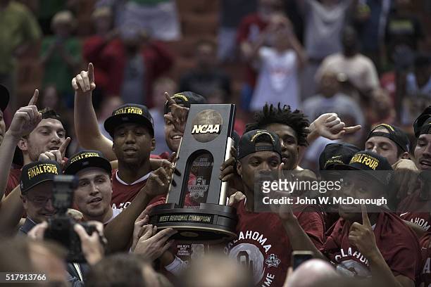 Playoffs: Oklahoma Buddy Hield and teammates victorious, holding West Regional Trophy after winning game vs Oregon at Honda Center. Anaheim, CA...