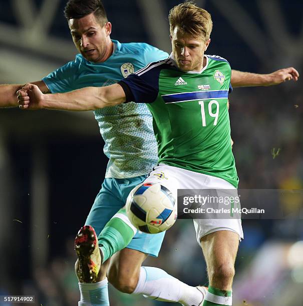 Jamie Ward of Northern Ireland and Samardzic Miral of Slovenia during the international friendly between Northern Ireland and Slovenia at Windsor...