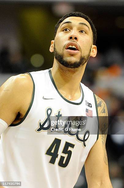 Denzel Valentine of the Michigan State Spartans rests during a break in the game against the Maryland Terrapins in the semifinals of the Big Ten...