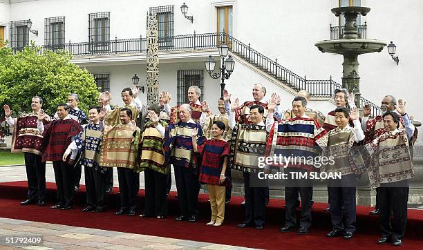 The APEC leaders pose for the family picture, 21 November 2004 at La Moneda Presidential Palace in Santiago. From L to R : Mexican President Vicente...