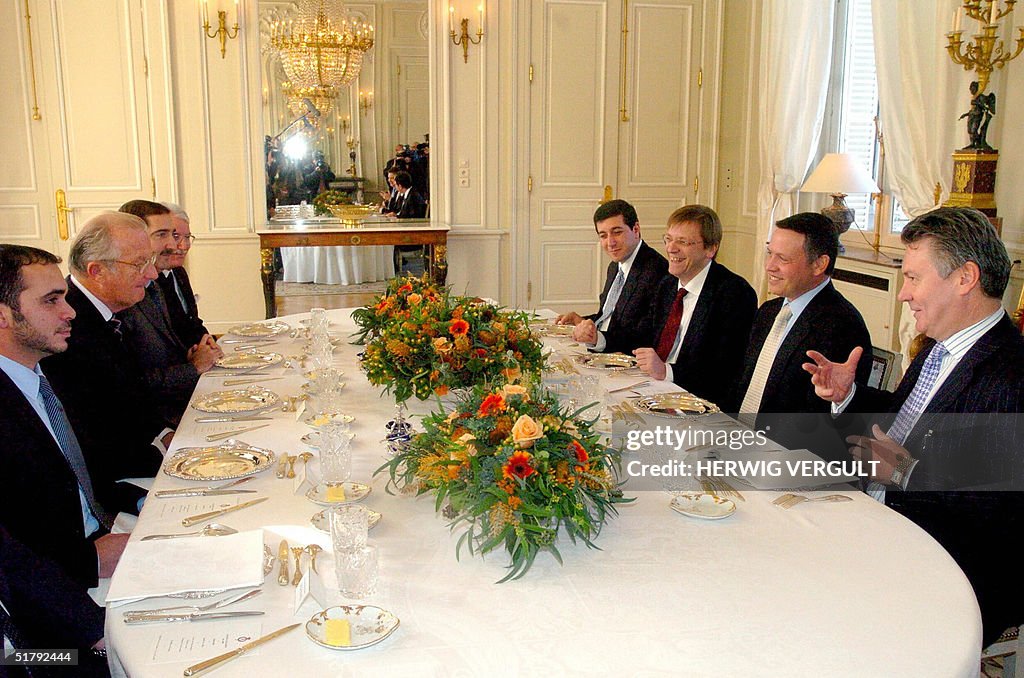 King Albert II of Belgium (2 nd-L) recei