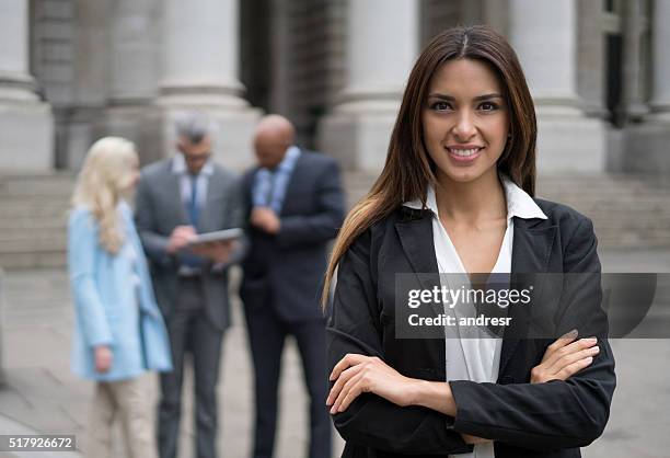 successful business woman with a group - human rights lawyer stock pictures, royalty-free photos & images