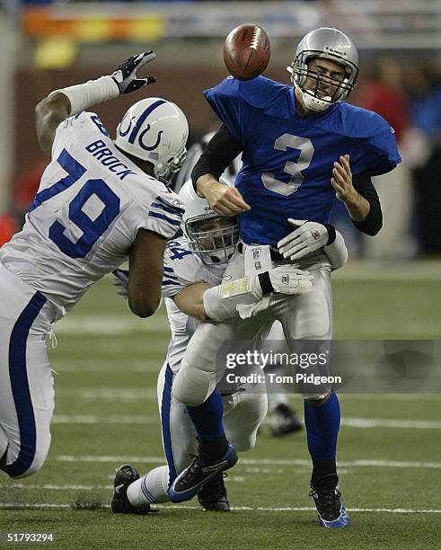 Rob Morris of the Indianapolis Colts sacks Joey Harrington of the Detroit Lions causing a fumble recovered by The Colts at Ford Field on November 25,...