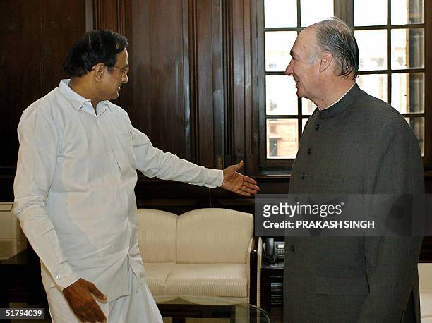 Indian Finance Minister P. Chidambaram gestures while talking to His Highness The Aga Khan during a meeting in New Delhi, 26 November 2004. The Aga...