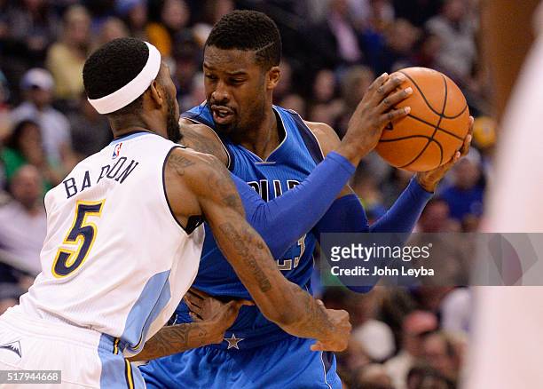 Dallas Mavericks guard Wesley Matthews gets guarded by Denver Nuggets forward Will Barton during the fourth quarter March 28, 2016 at Pepsi Center.