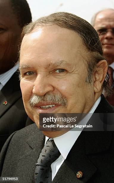 Algerian President Abdelaziz Bouteflika poses as he arrives to attend the 10th Francophonie on November 26, 2004 in Ouagadougou, Burkina-Faso. The...