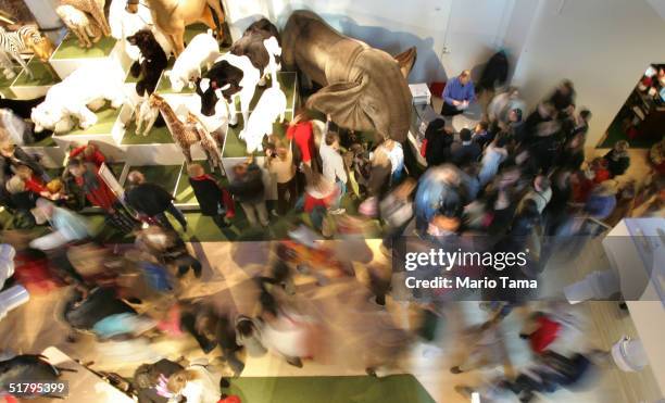 Shoppers crowd FAO Schwarz the day after its grand re-opening November 26, 2004 in New York City. The Friday after Thanksgiving, called "Black...