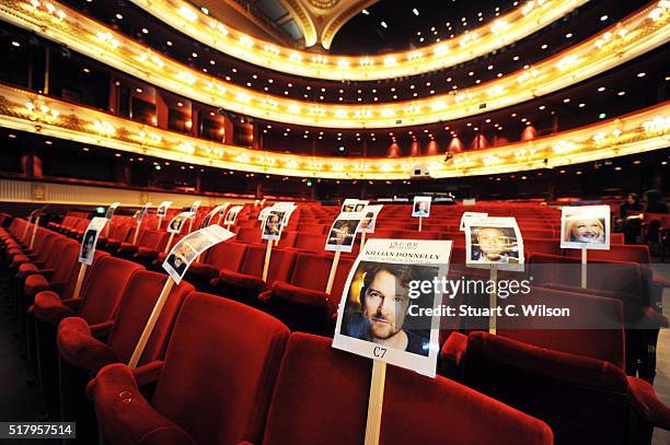 Seat markers with faces of nominees are seen in position during the 'heads on sticks' photocall ahead of the Olivier Awards, which takes place on...