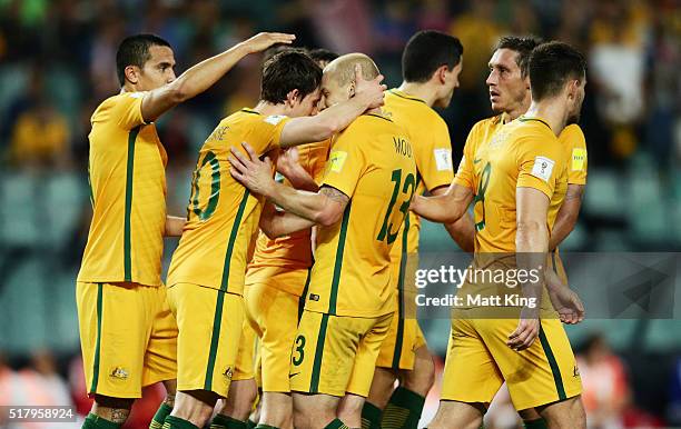 Tim Cahill of the Socceroos celebrates with Robbie Kruse and Aaron Mooy after scoring his second goal during the 2018 FIFA World Cup Qualification...