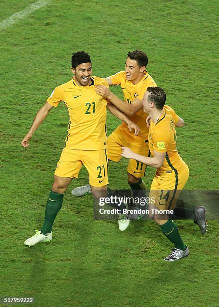 Massimo Luongo of Australia celebrates with team mates Christopher Ikonomidis and Brad Smith after scoring a goal during the 2018 FIFA World Cup...