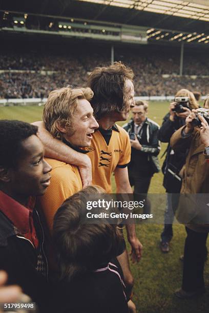 Wolves striker Derek Dougan embraces Manchester City striker Denis Law after the 1974 League Cup Final between Wolverhampton Wanderers and Manchester...