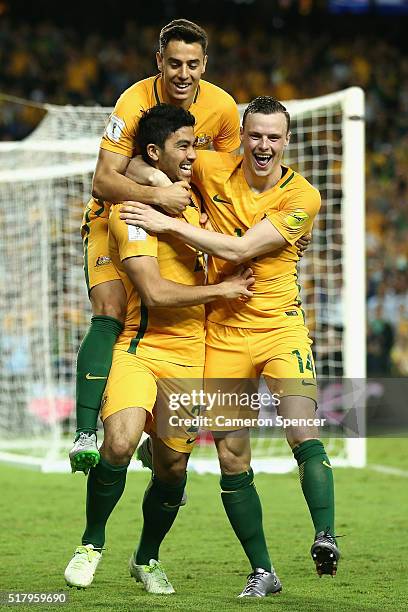 Massimo Luongo of Australia celebrates scoring a goal with team mates Christopher Ikonomidis and Brad Smith during the 2018 FIFA World Cup...