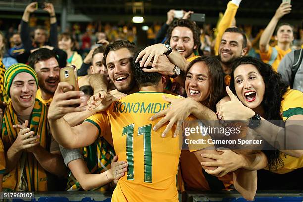 Christopher Ikonomidis of Australia celebrates with fans after winning the 2018 FIFA World Cup Qualification match between the Australian Socceroos...