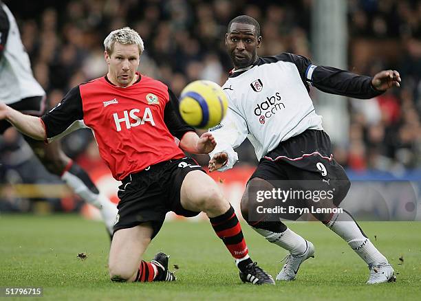 Andy Cole of Fulham battles with Andy Todd of Blackburn during the Barclays Premiership match between Fulham and Blackburn Rovers at Craven Cottage...