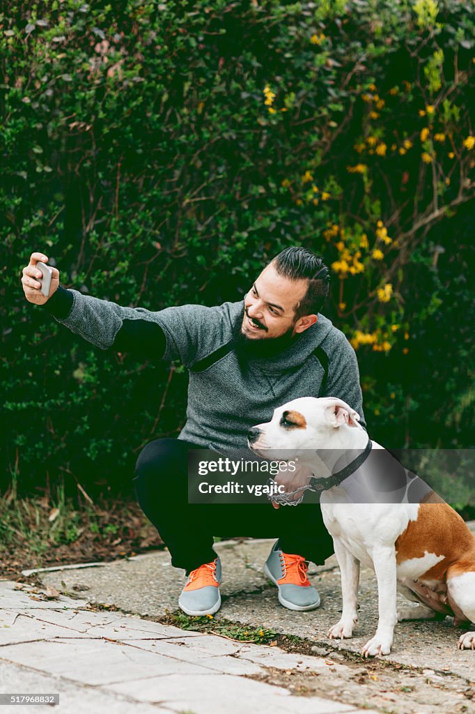 Man Making Selfie With His Dog Outdoors.