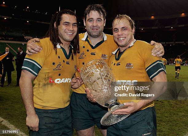 Wallabies back-row forwards, George Smith, David Lyons and Phil Waugh hold the The Cook Cup after winning the Investec Challenge match between...