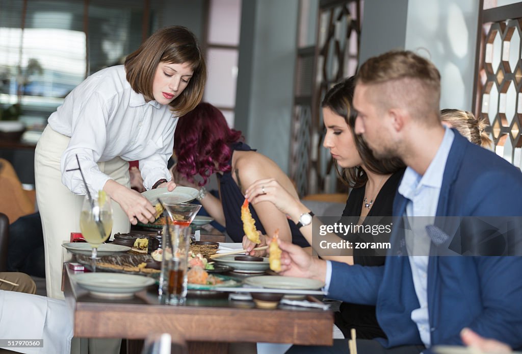 Woman taking food in restaurant