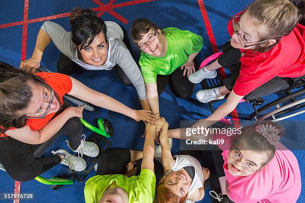 group of special needs girls showing team spirit - disability bildbanksfoton och bilder