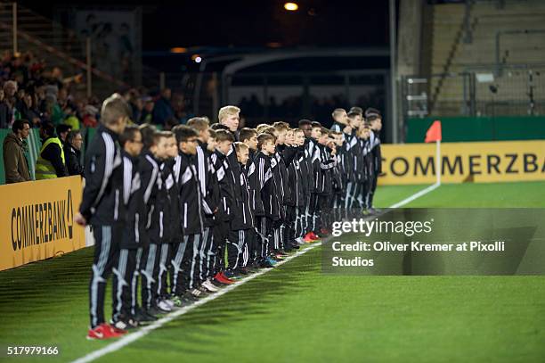 Ball Boys lined up along the field line while national anthems are played at Frankfurter Volksbank-Stadion during the international football match...