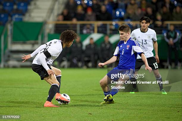 U21d19+ dribbling with the ball while Jonas Gejel Hansen of Faeroer Islands trying to interfere at Frankfurter Volksbank-Stadion during the...