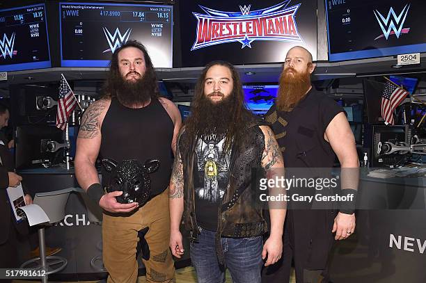 Wrestlers Braun Strowman, Bray Wyatt and Erick Rowan pose for a picture prior to ringing the New York Stock Exchange opening bell in honor of...
