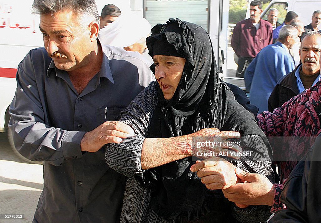 A wounded elderly Iraqi woman is evacuat