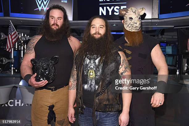 Wrestlers Braun Strowman, Bray Wyatt and Erick Rowan pose for a picture prior to ringing the New York Stock Exchange opening bell in honor of...