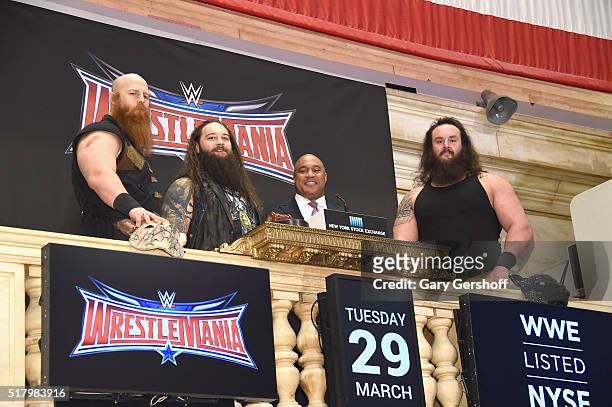 Wrestlers Erik Rowan and Bray Wyatt, Global Head of Capital Markets at NYSE, Garvis Toler and WWE wrestler Braun Strowman ring the New York Stock...