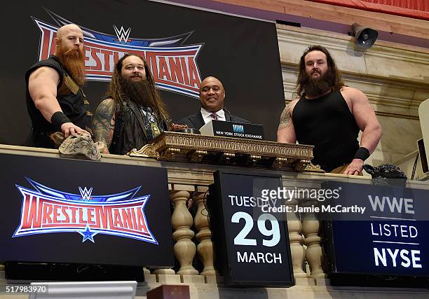 Superstars Erick Rowan, Bray Wyatt and Braun Strowman with NYSE Global head of capital markets Garvis Toler ring The New York Stock Exchange Opening...