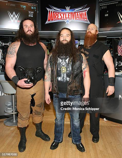 Professional wrestlers Braun Strowman, Bray Wyatt and Erick Rowan attend WWE WrestleMania Stars Ring The NYSE Opening Bell at New York Stock Exchange...