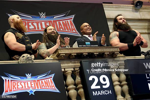 Professional wrestlers Erick Rowan and Bray Wyatt, Global Head of Capital Markets at NYSE, Garvis Toler, and WWE professional wrestler Braun Strowman...