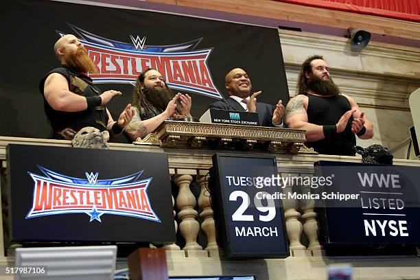 Professional wrestlers Erick Rowan and Bray Wyatt, Global Head of Capital Markets at NYSE, Garvis Toler, and WWE professional wrestler Braun Strowman...