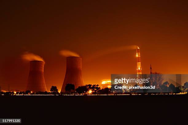 nuclear plant at night - energy industry stock pictures, royalty-free photos & images