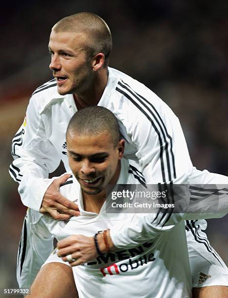 Real Madrid?s David Beckham jumps on top of Ronaldo after Ronaldo's goal against Levante during their la Liga match at the Bernabeu, November 28 in...