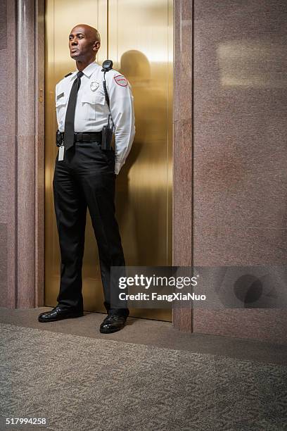 security peronnel standing guard - security guard stock pictures, royalty-free photos & images