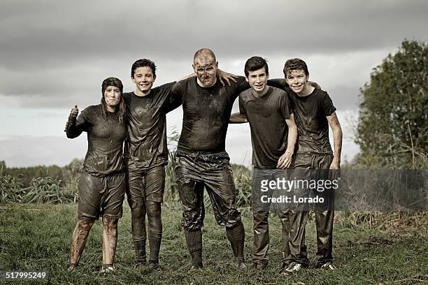family covered by dirt during mud run - mud runner stock pictures, royalty-free photos & images