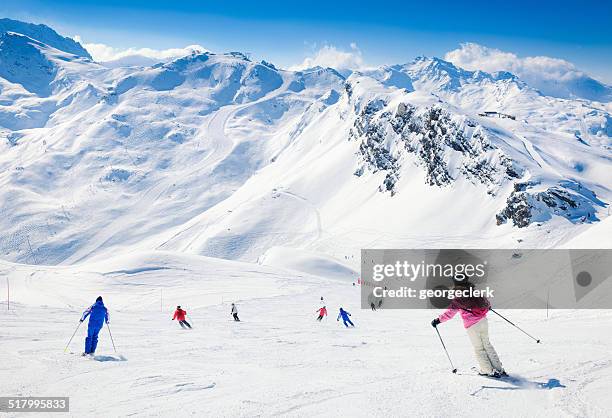 skiers at meribel in the three valleys - meribel stock pictures, royalty-free photos & images