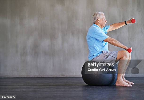 combat aging one kilo at a time - medicine ball stockfoto's en -beelden