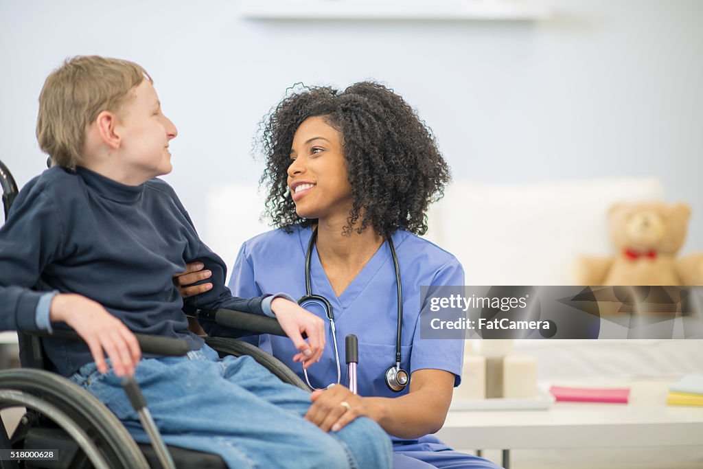 Nurse Talking to a Disabled Child