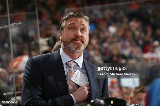 Head coach Patrick Roy of the Colorado Avalanche looks up at the scoreboard during the game against the Philadelphia Flyers at the Pepsi Center on...